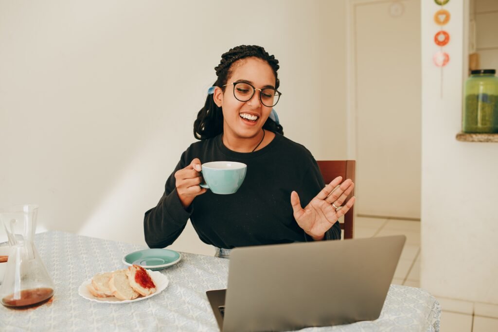 girl attending a virtual coffee chat from home